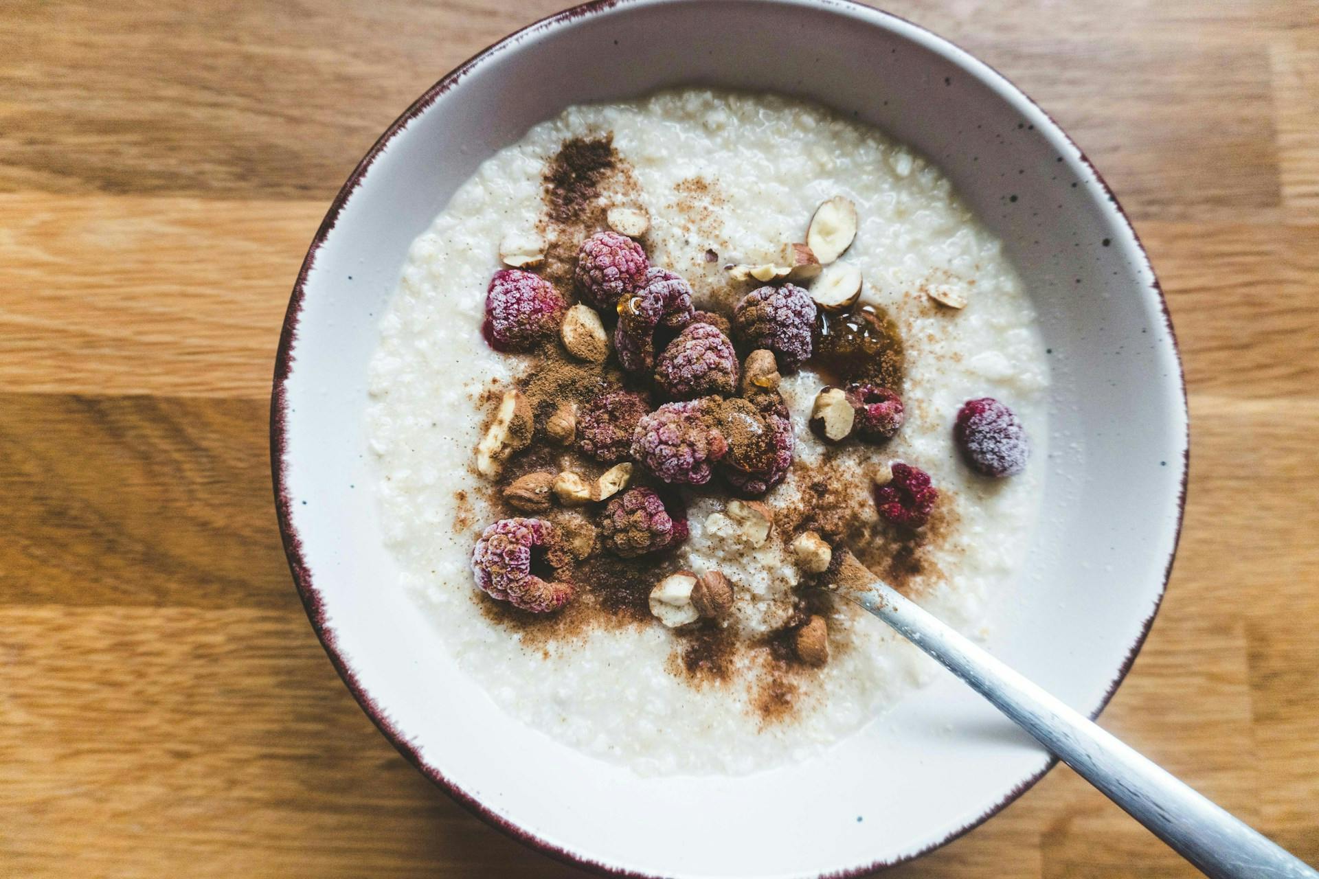Porridge with frozen raspberries and nuts