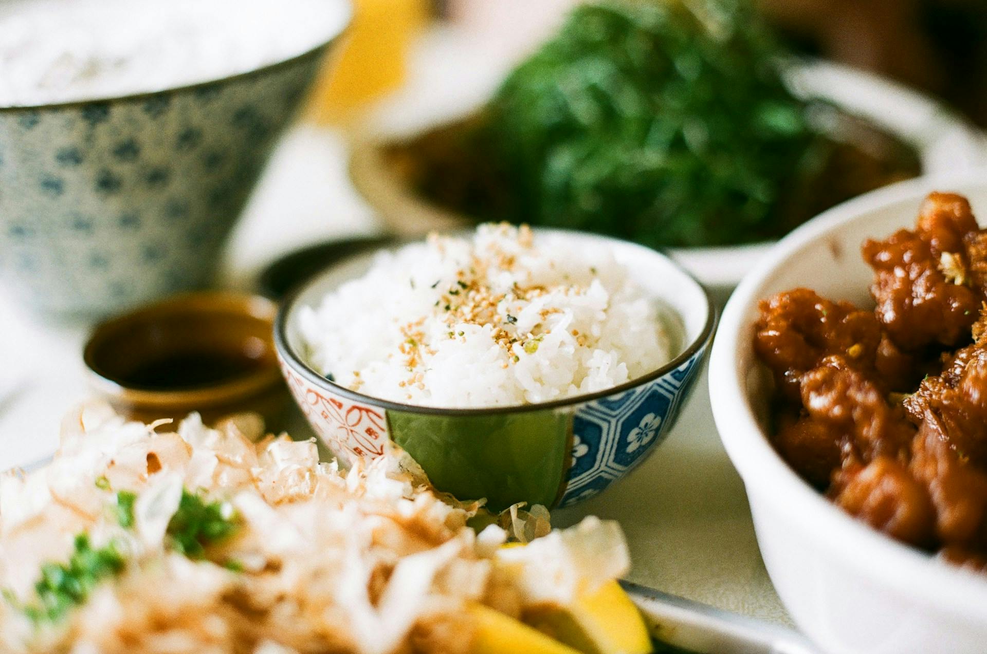bowl of sticky rice and other dishes