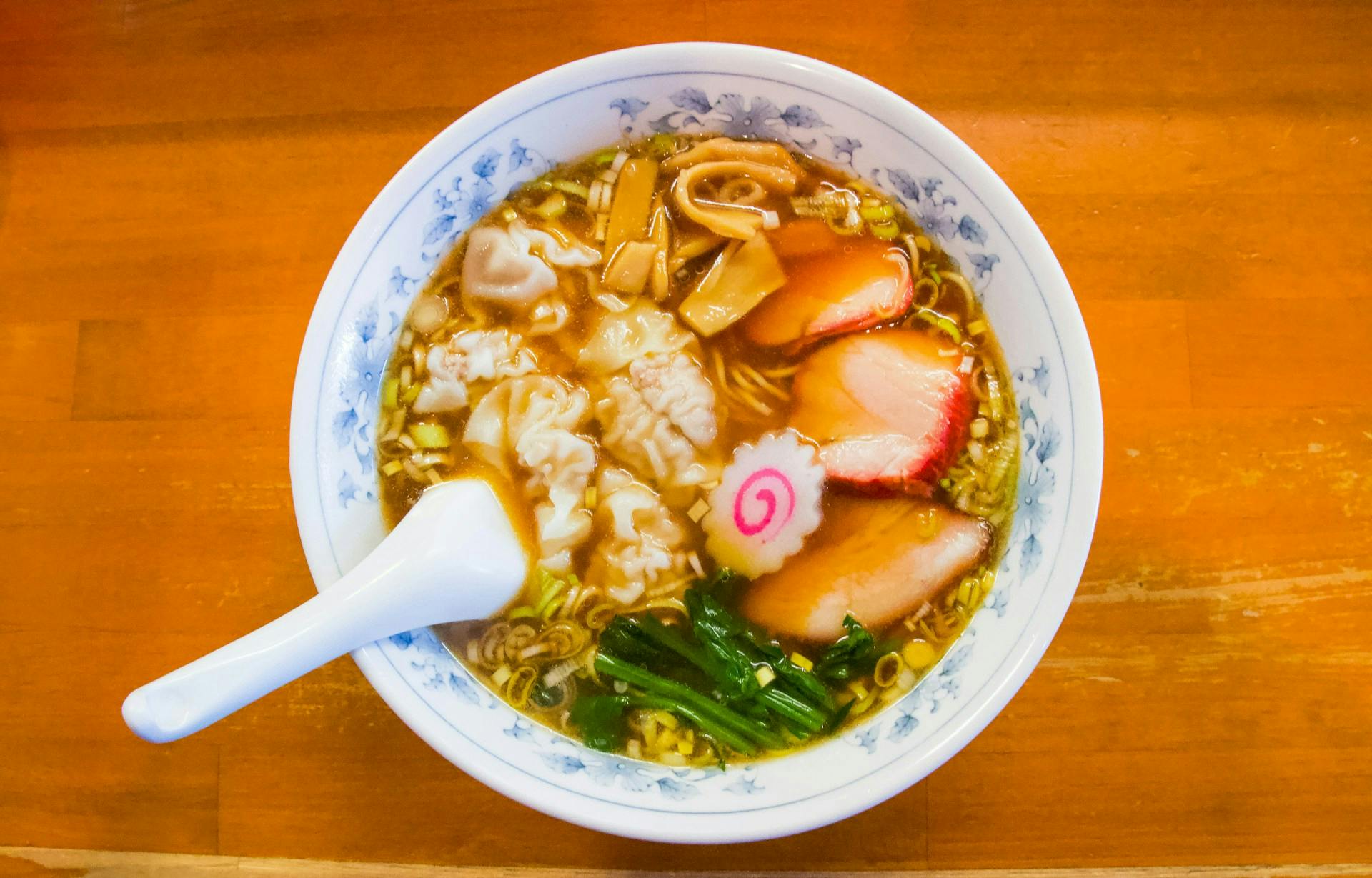 Ramen instant noodles with toppings including fish cakes