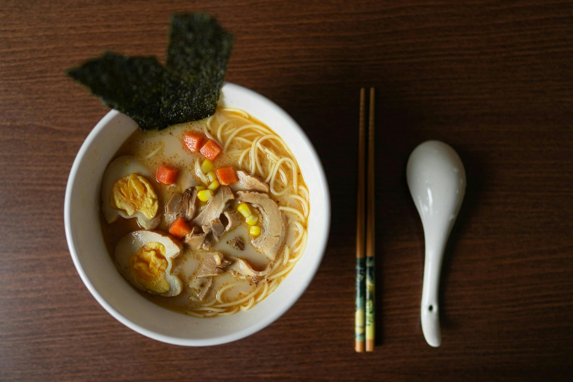 Ramen noodles with broth, seaweed and toppings