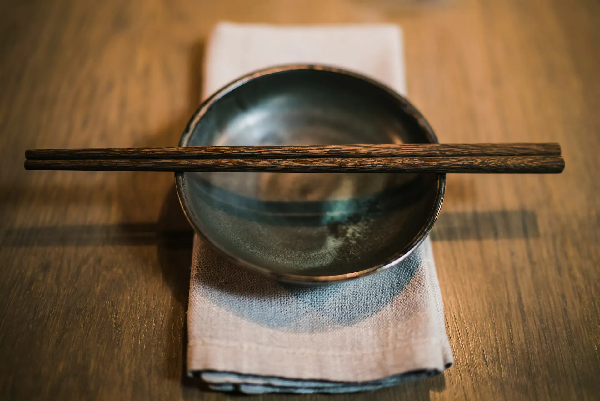 Wooden chopsticks on a bowl