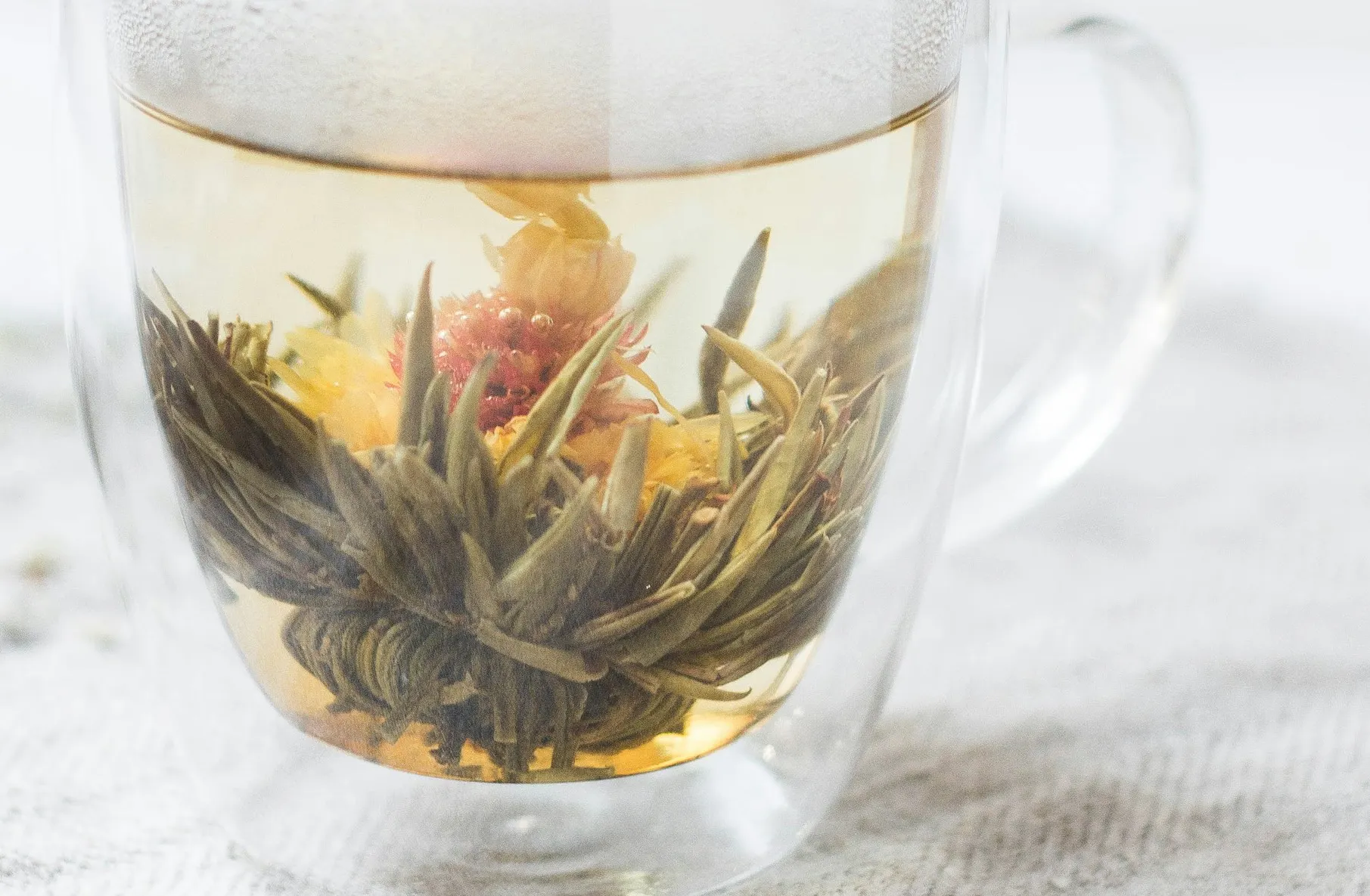 Flowering tea in a glass mug