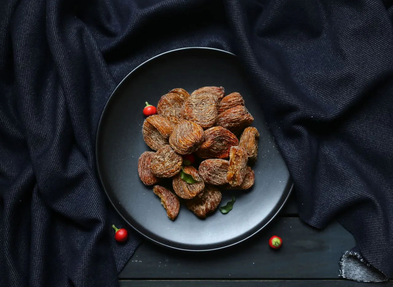 Umeboshi plums on black plate