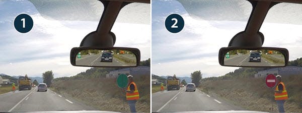 Des ouvriers utilisant des piquets mobiles pour gérer la circulation alternée.