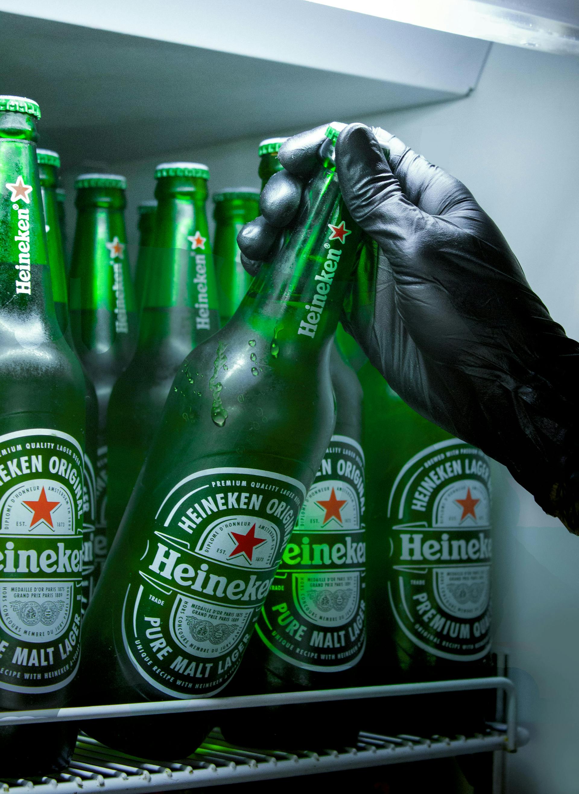 Refrigerator full of Heineken bottles