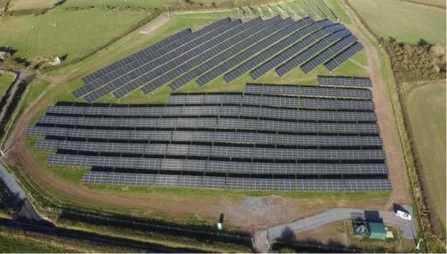 A large solar panel farm spanning over four acres.