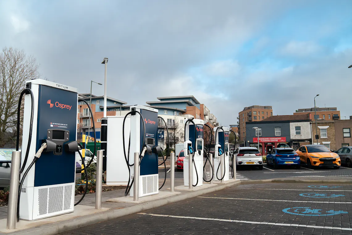 A charging hub of Osprey ev charging stations in a busy car park