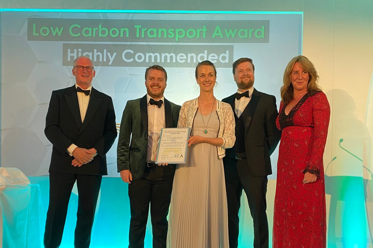 Lewis Gardiner (Head of Operations) and Dora Clarke (Head of Marketing) accept the Award from host Lucy Siegle and the Renewable Energy Association team