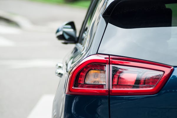 Closeup of rear light on blue Kia e-Niro parked in the street