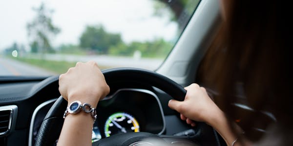 A woman driving a car.