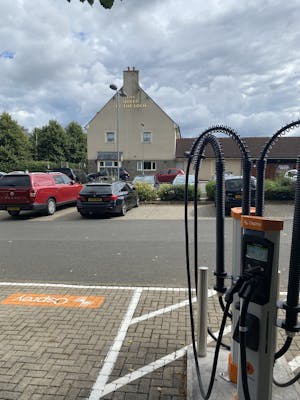 Two Osprey chargers in front of the Queen of the Loch Pub and Restaurant