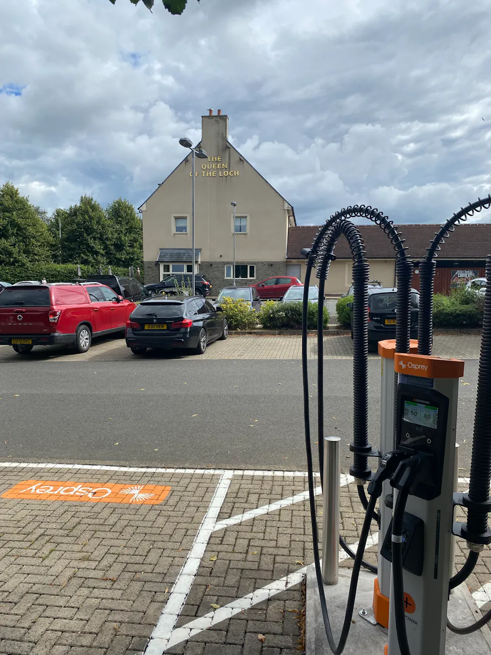 Two Osprey chargers in front of the Queen of the Loch Pub and Restaurant