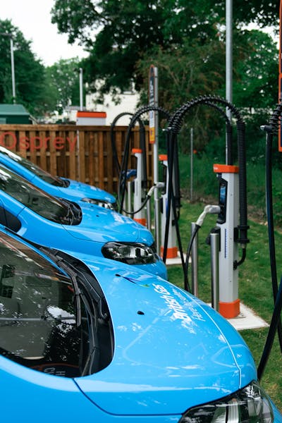 British Gas vans plugged into an ultra-rapid Osprey electric vehicle charging station