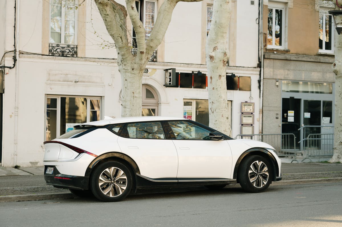 Stock photo of the Kia Ev6 parked on a high street.