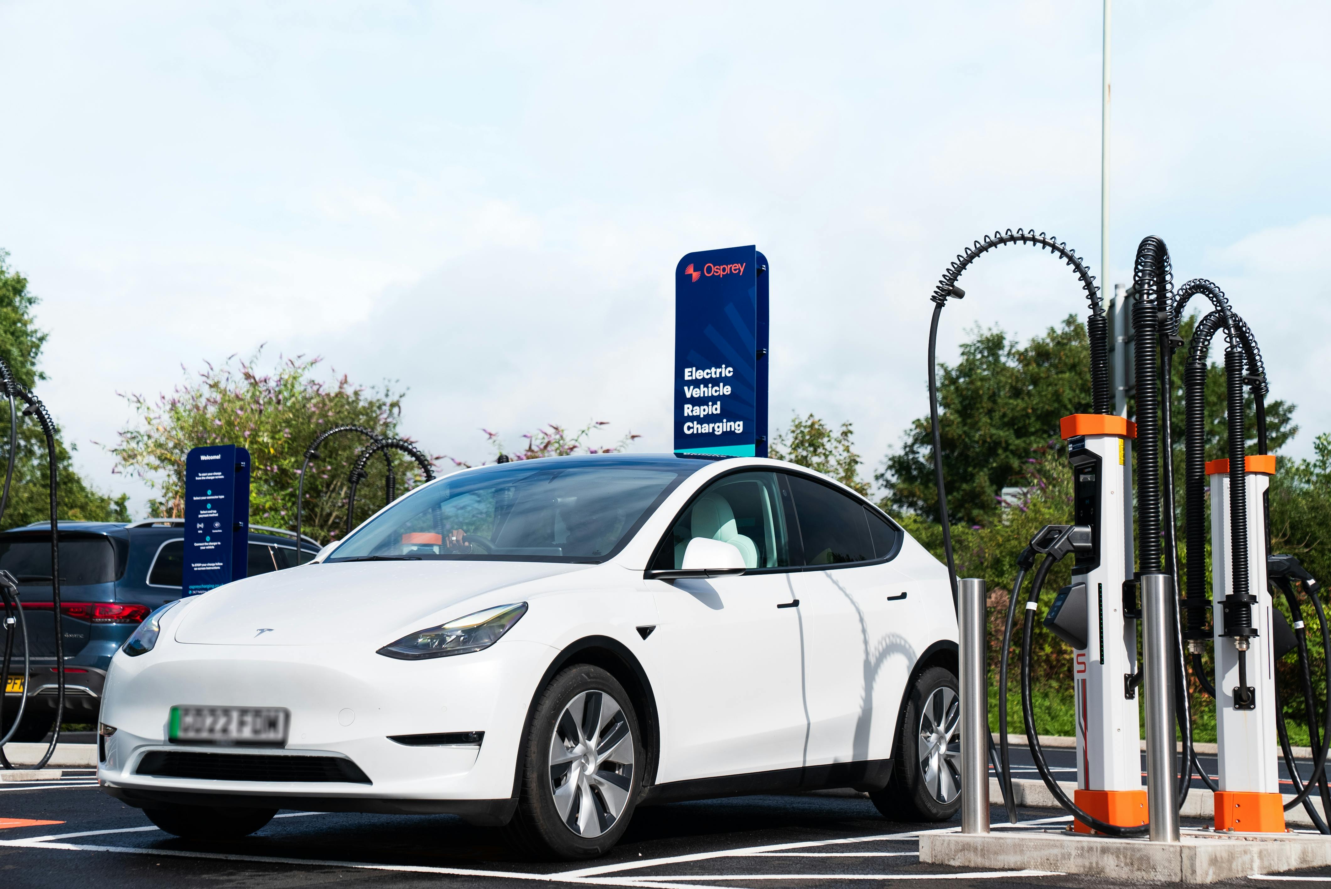 Tesla pulling into an Osprey Charging bay.