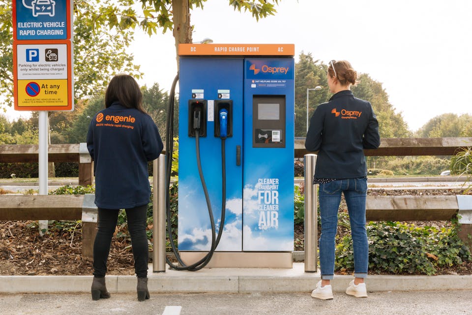 A woman in an Engenie jacket and a woman in an Osprey jacket stand side by side