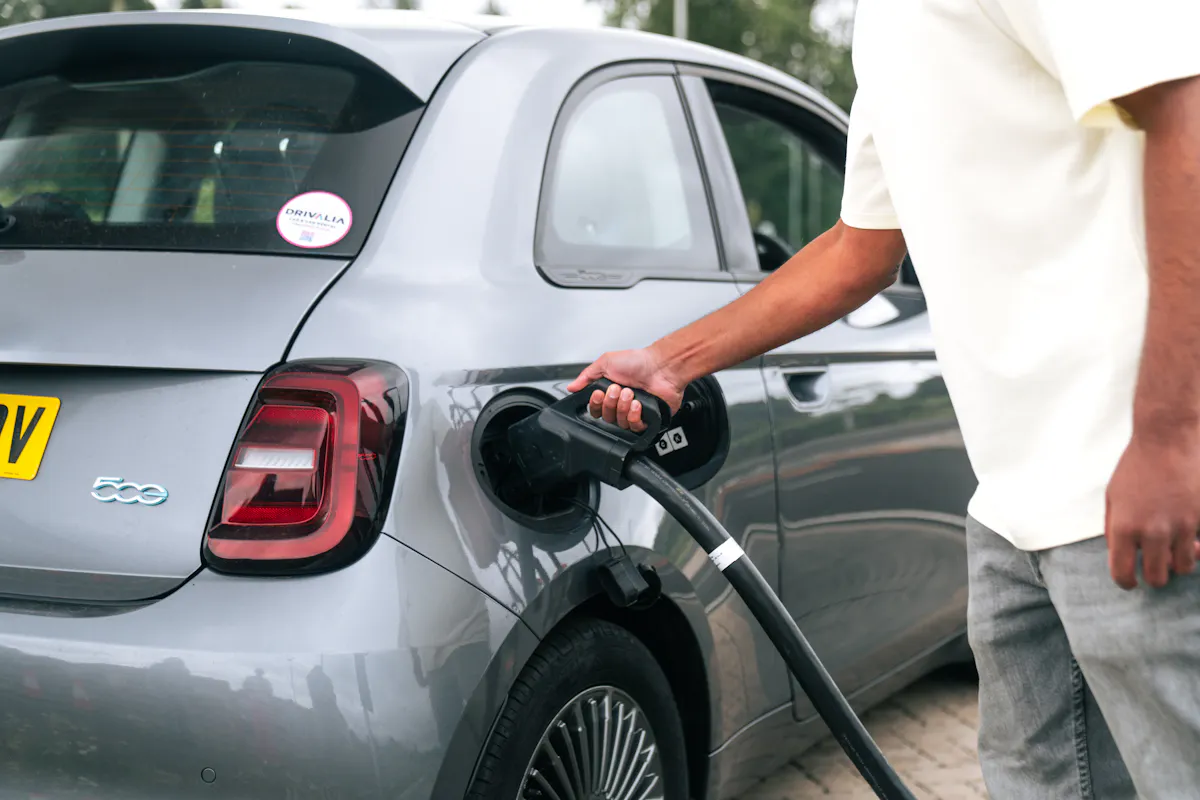 Fiat 500e being plugged in to charge