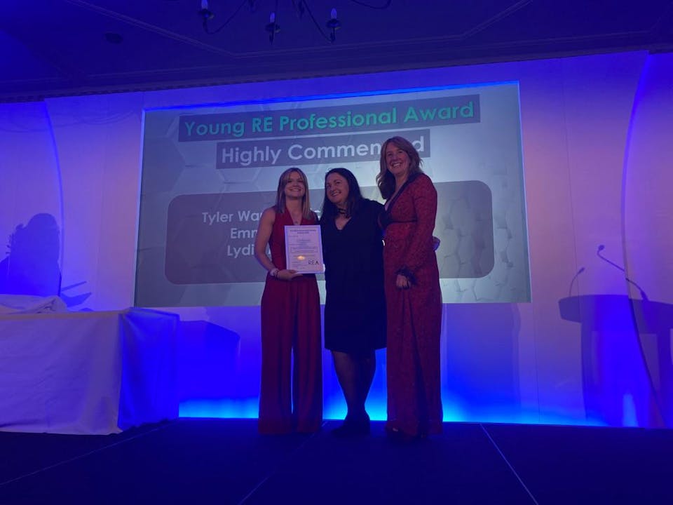 Lydia Macdonell (Project Manager) accepts the Award from host Lucy Siegle and the Renewable Energy Association team