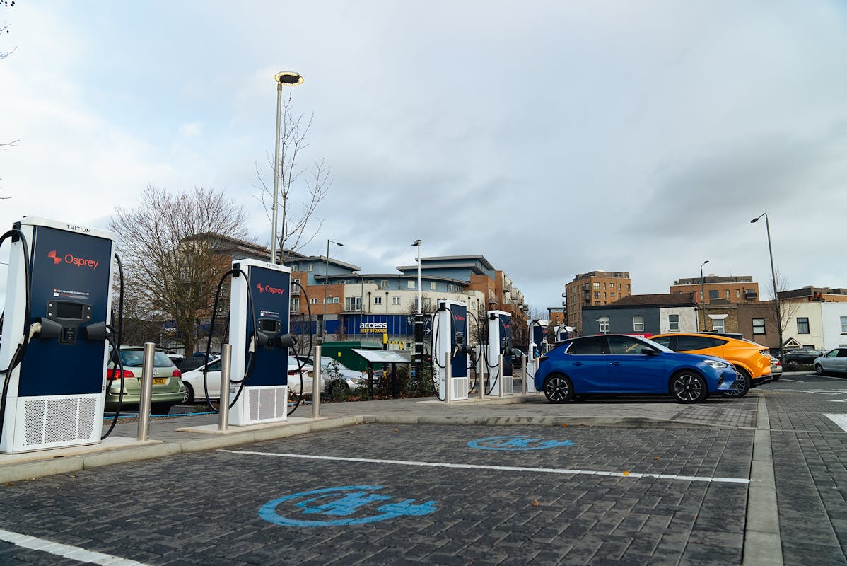 A charging hub of Osprey ev charging stations with electric cars plugged in