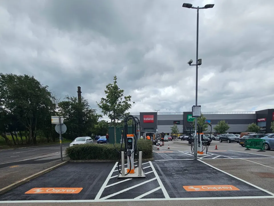 Two high-powered electric car chargers at a retail park