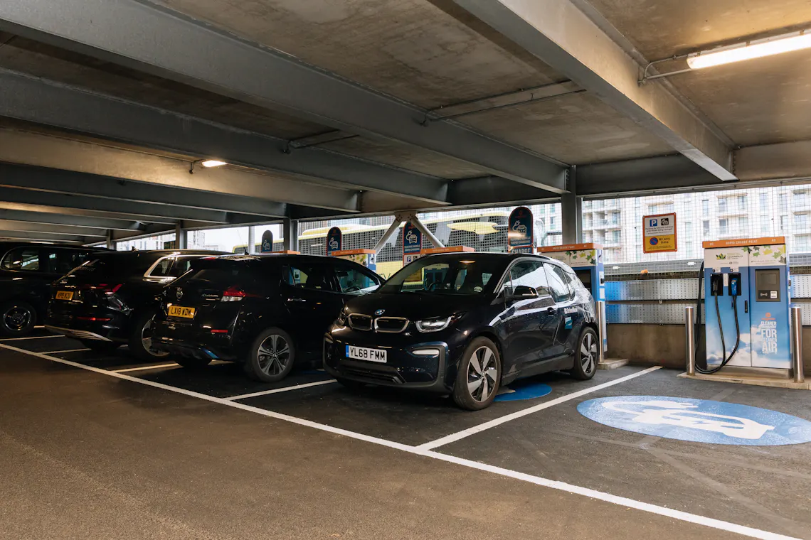 Four black vehicles parked at an Osprey rapid charging hub