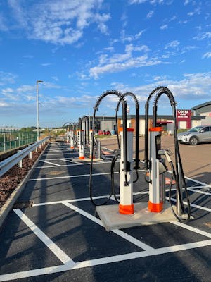 An accessibly designed Osprey EV charging hub with weight managed cables, no kerbs and space between parking bays.