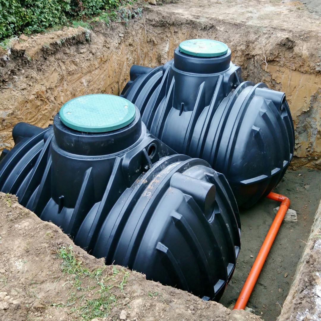 Two below ground tanks sat in a large hole (uncovered)