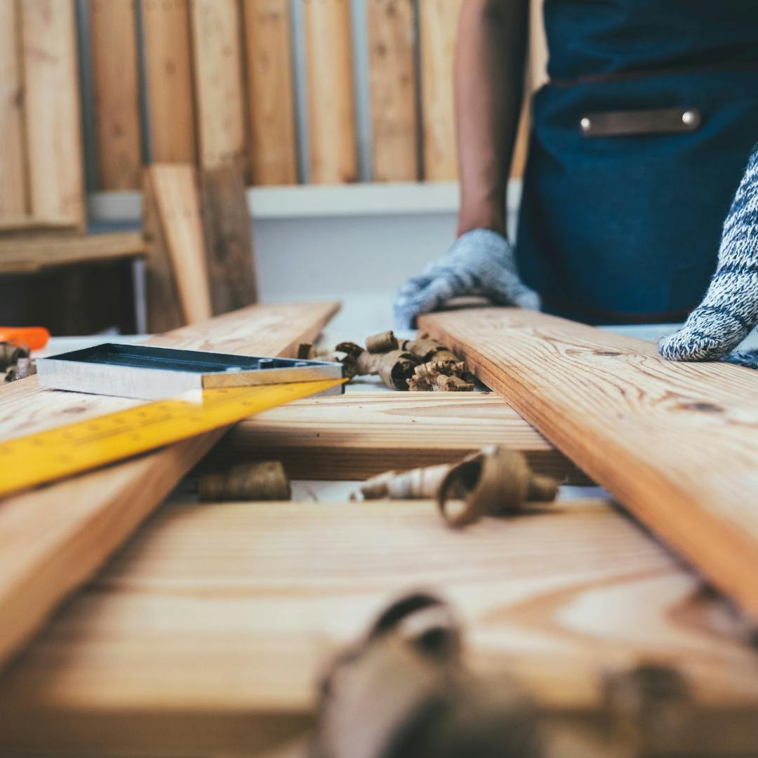 tools and wood on a table in a workshed