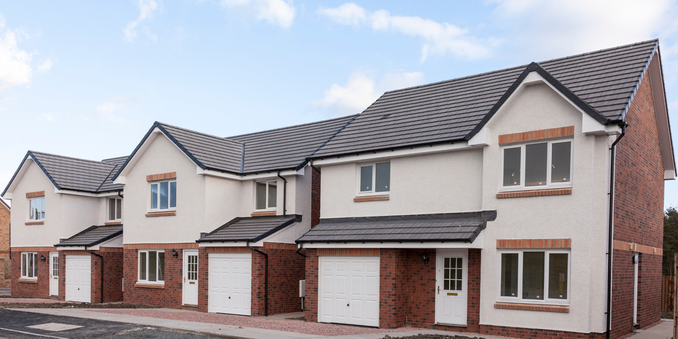 A picture of a row of terraced new build homes