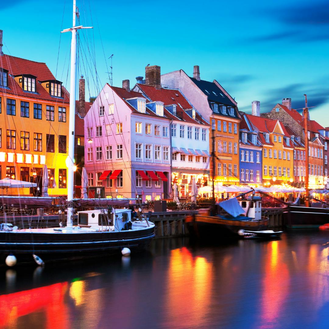 A shot looking at some colourful houses adjacent to the river in Copenhagen