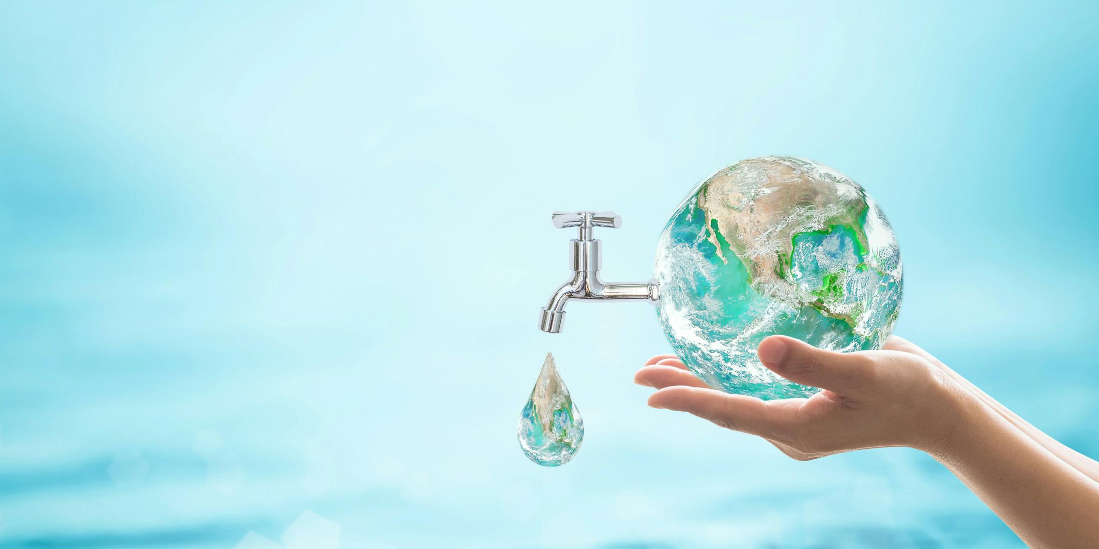 hands holding a water globe with tap attached
