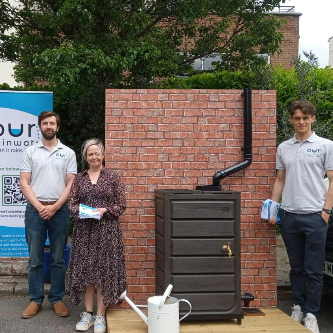 Pete, Sarah and Charlie stood by a rainplanter demo stand 