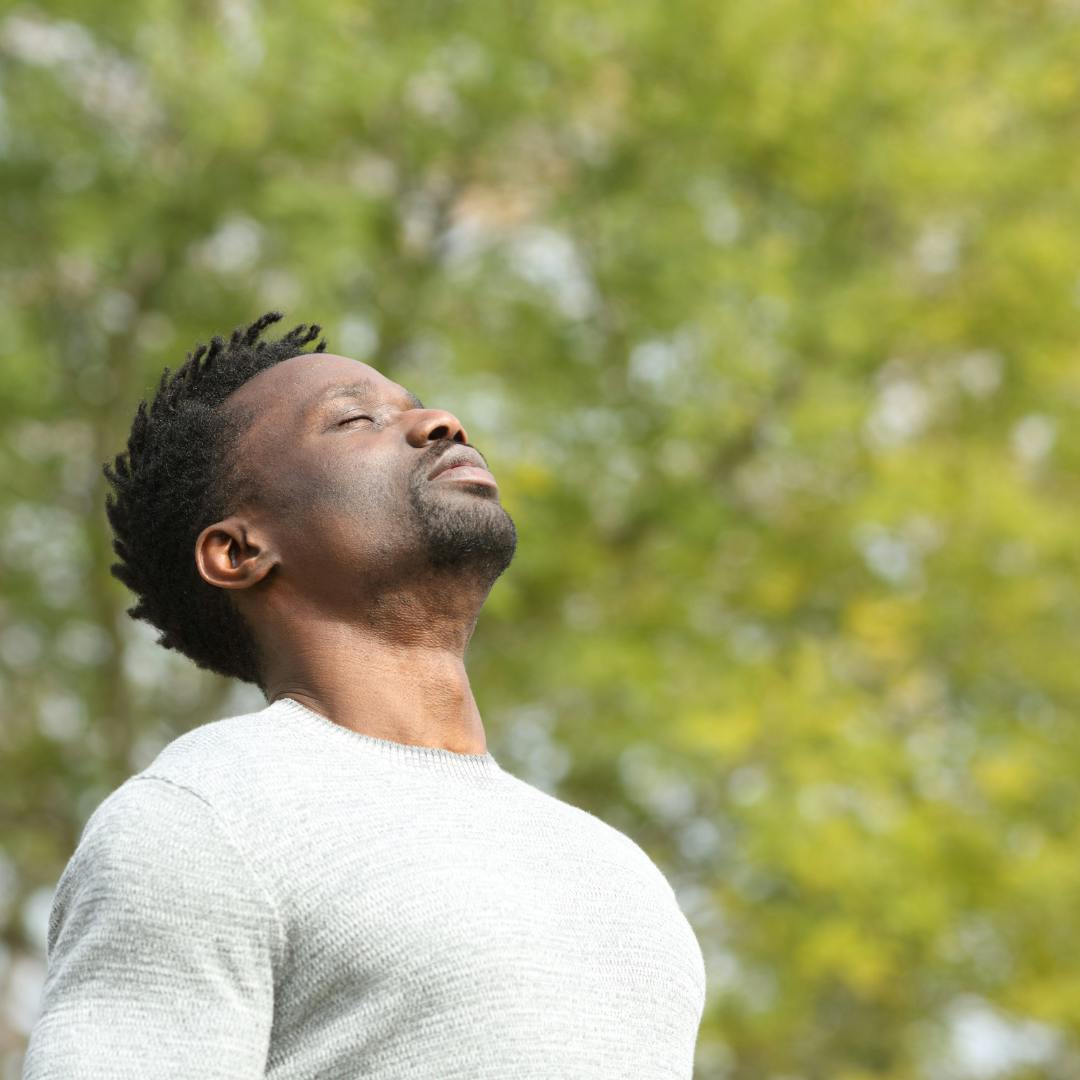 Man taking in a deep breath