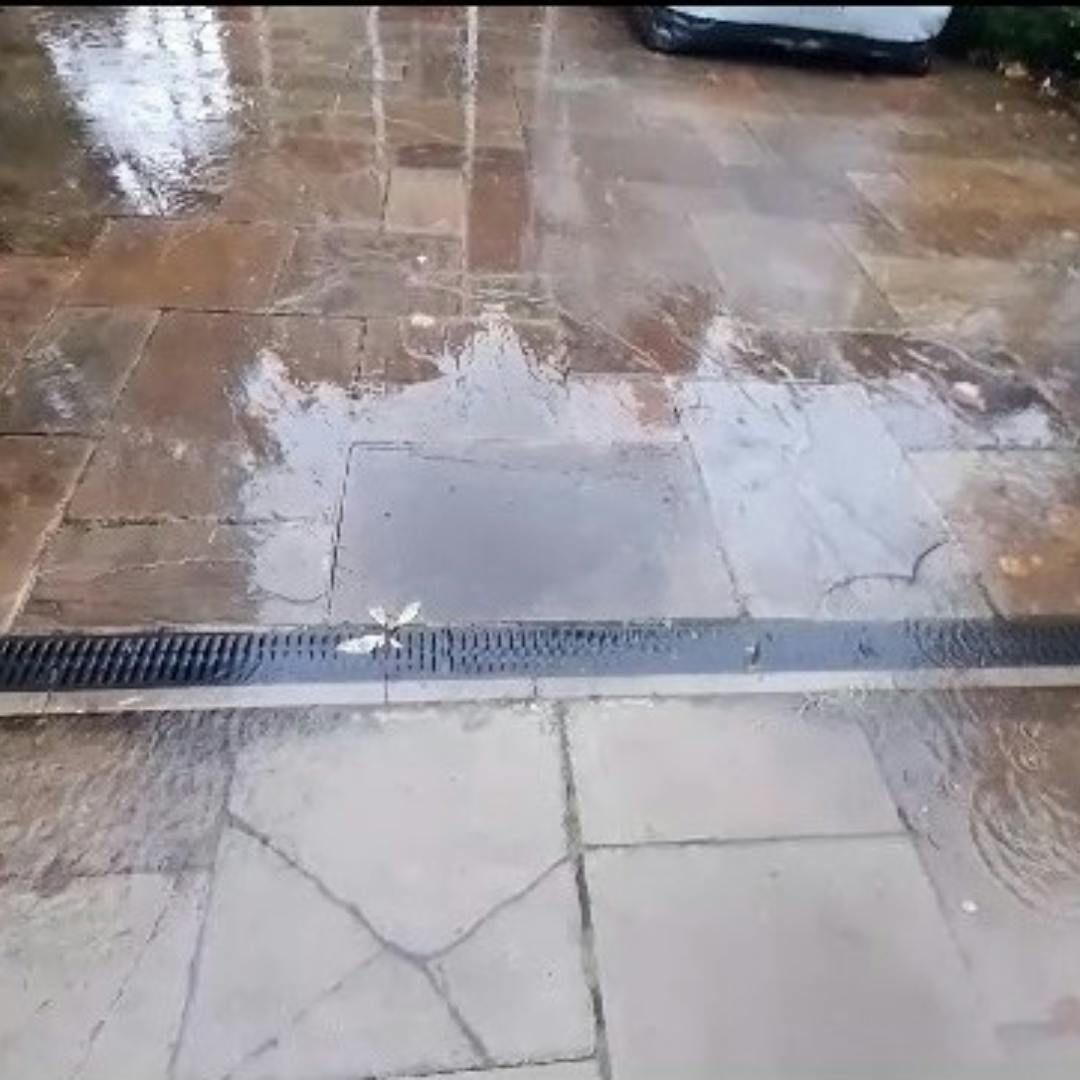 surface water flooding on a paved garden 