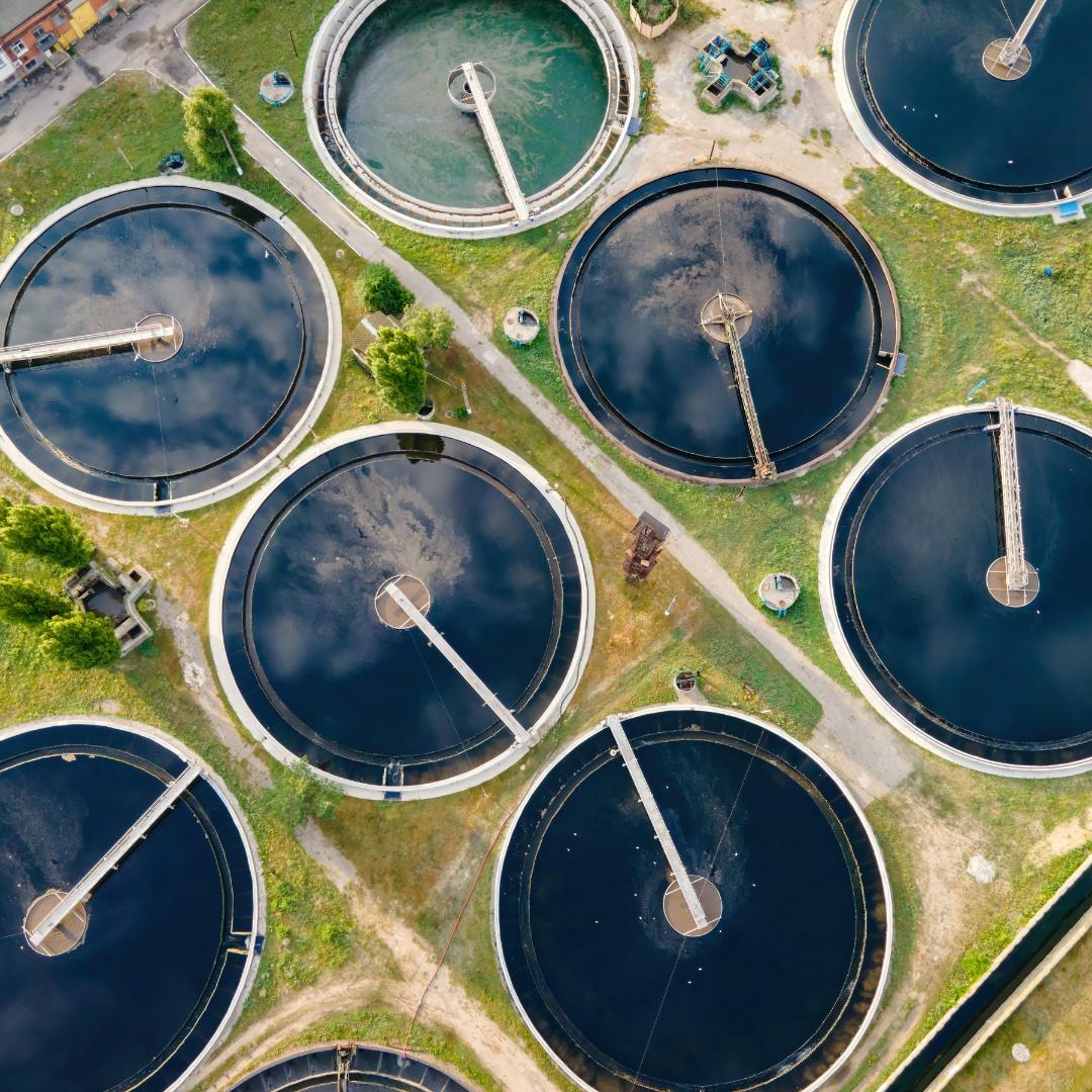 Aerial view of circular pits of water being treated