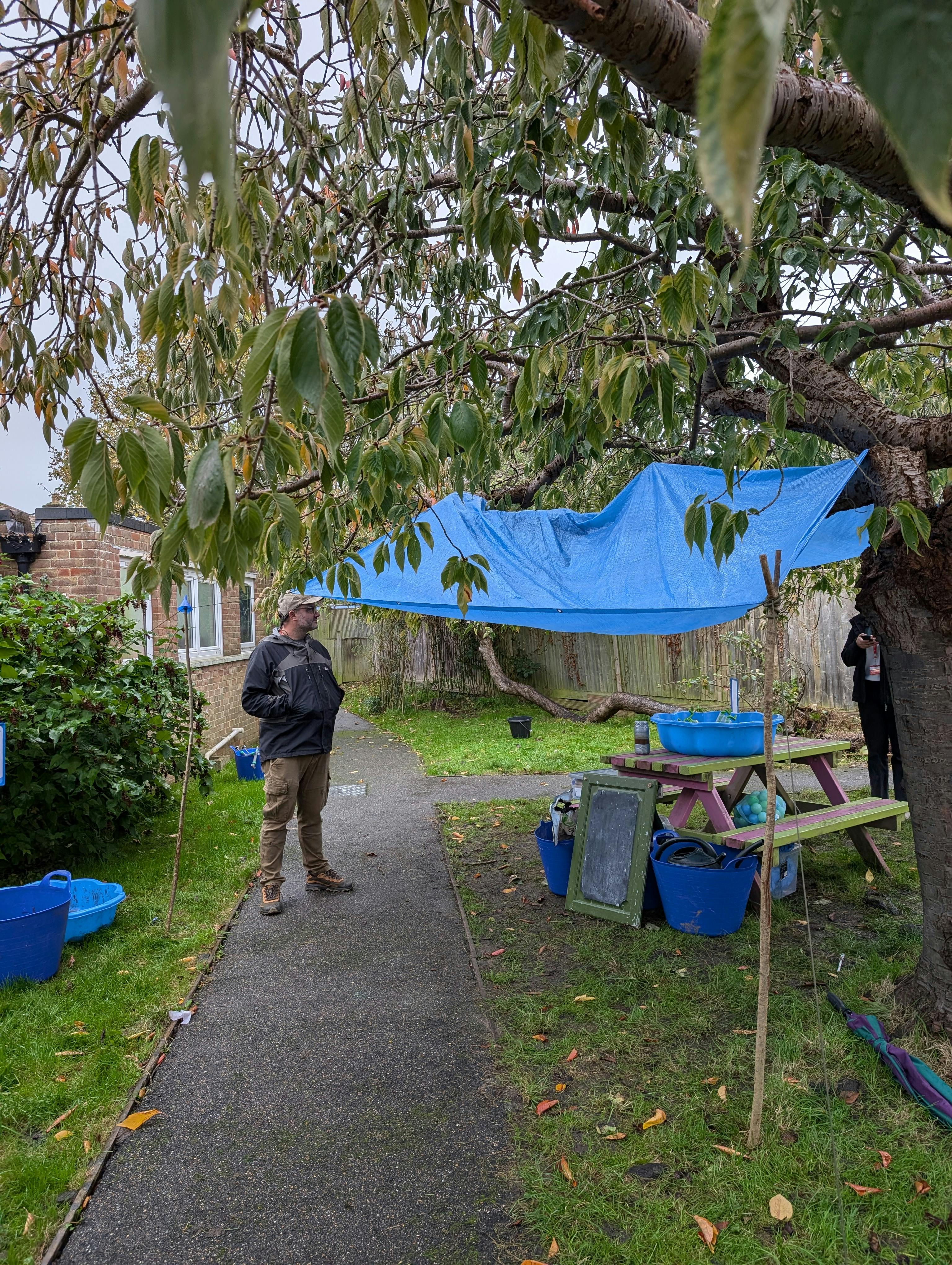 Nick stood under a tarp canopy