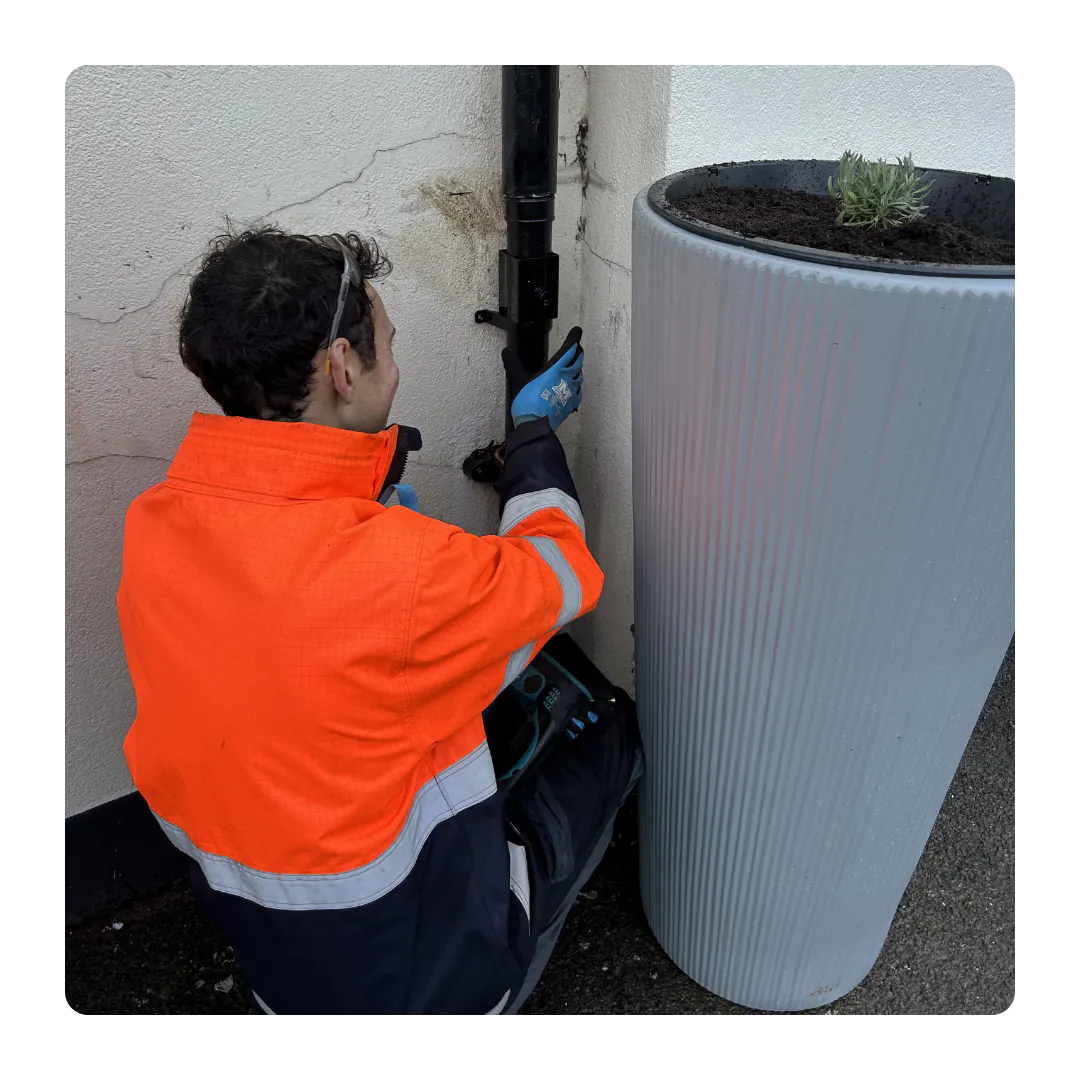 Ari installing a planter at a torbay school