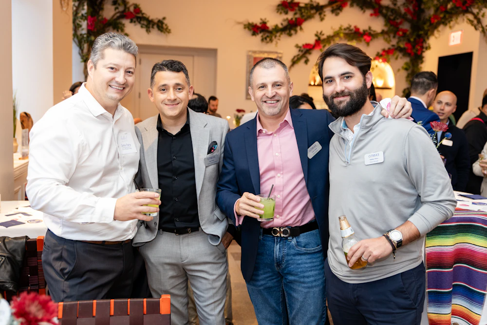 Group of employees at client appreciation event posing for the photo