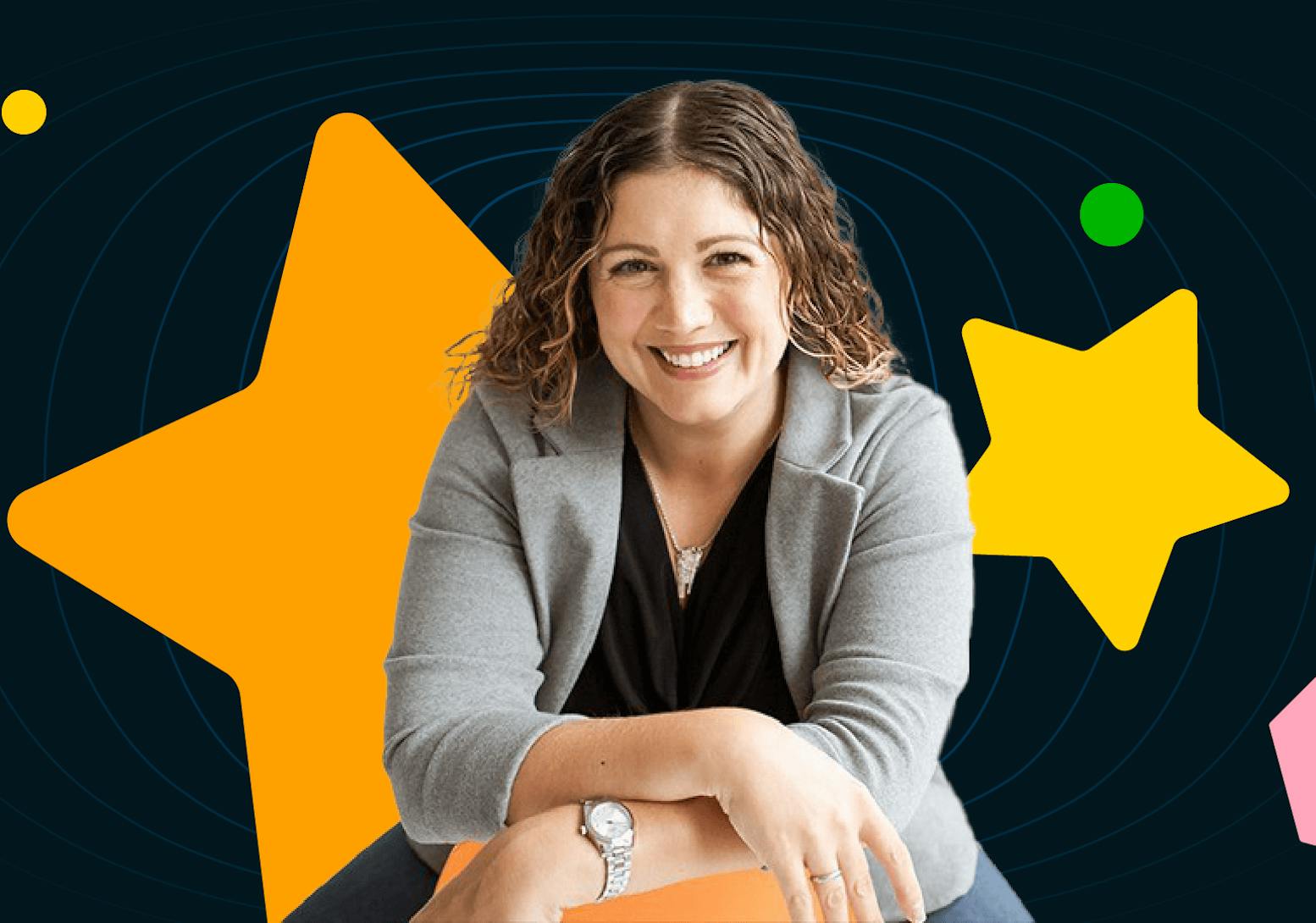 Brand Trifecta founder Kate DiLeo wears a gray blazer and black shirt against a black background with a variety of colorful shapes.