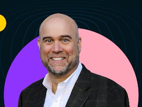 Founder of Ignite Selling Steve Gielda smiles while wearing a suit jacket and white collared shirt.