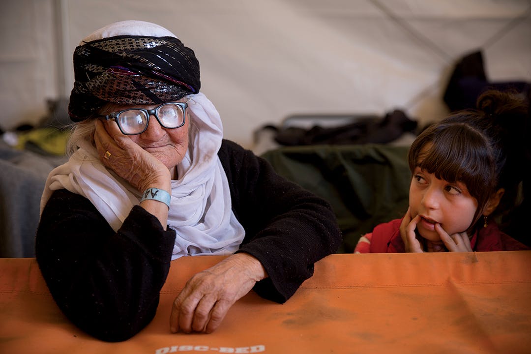 Shereen, an 85 year-old Yazidi grandmother who escaped the ISIS onslaught in Sinjar (aka Shengal), Iraq, in a tent at Idomeni Camp in Greece. One of her two grown sons is in Germany, the other in Sweden. Akram Hamo, her nephew, said he and his family helped bring her to Europe.