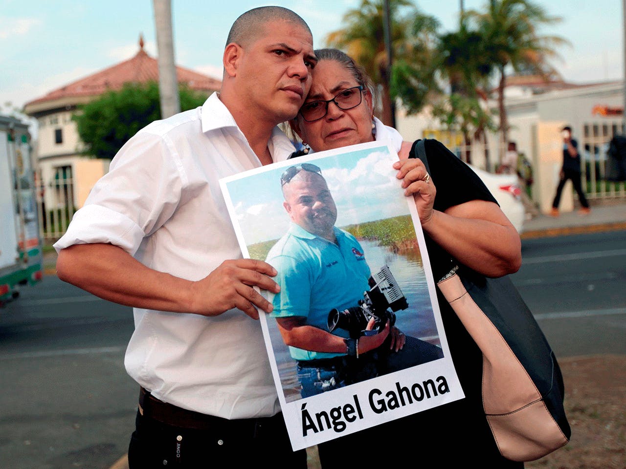 THE MOTHER AND BROTHER OF JOURNALIST ÁNGEL GAHONA—WHO DIED DURING THE PROTESTS FOLLOWING AN ATTEMPT BY PRESIDENT DANIEL ORTEGA TO REFORM THE NEAR-BANKRUPT SOCIAL SECURITY SYSTEM — TAKE PART IN A PROTEST AT THE RUBEN DARIO ROUNDABOUT IN MANAGUA, MAY 10, 2018