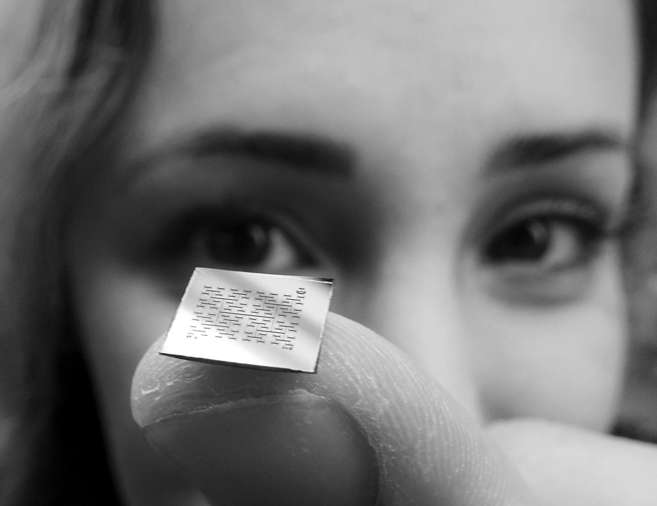 GRADUATE STUDENT SABA MOSLEHI HOLDS ONE OF TAYLOR’S CHIPS.