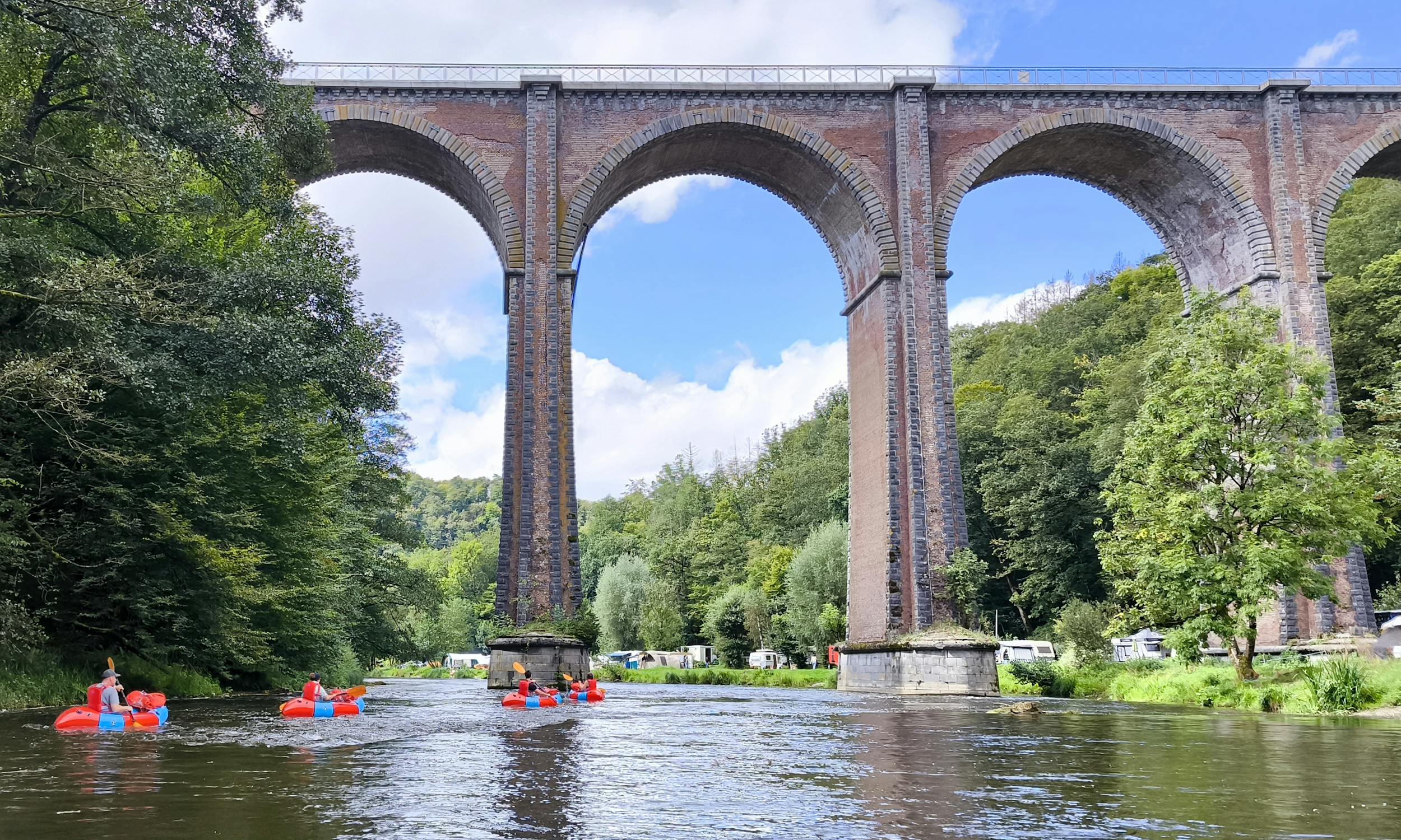 Packrafting under bridge
