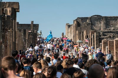 Visitors on Via dell' Abbondanza in Pompeii. The site is set to receive a record-breaking number of visitors this year.