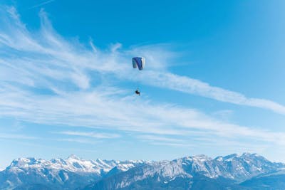 A paraglider above the Alps