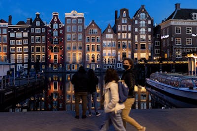 Empty canal boats in the center of Amsterdam. Ilvy Njiokiktjien for The New York Times