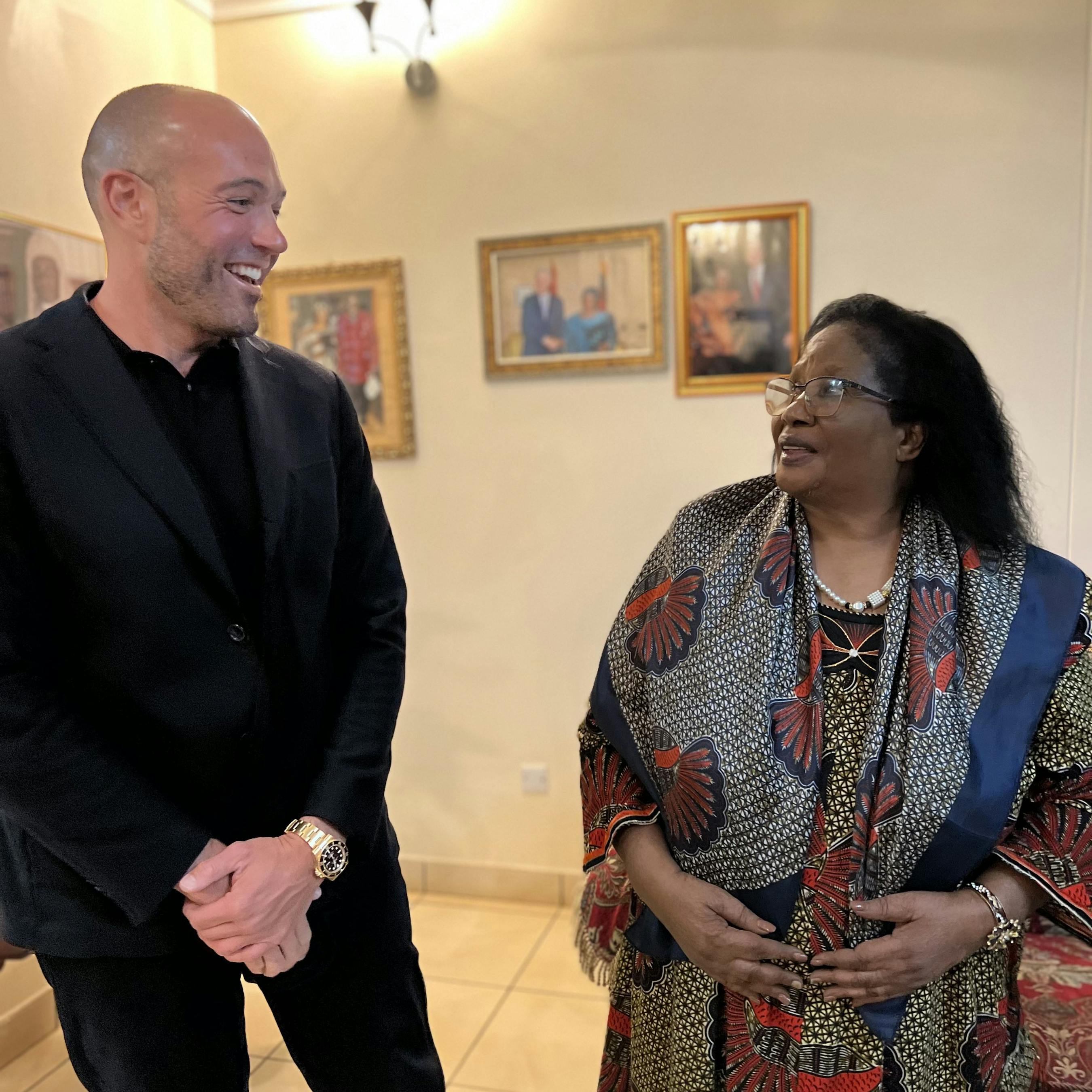 President Joyce Banda of Malawi and Nicholas Palahnuk discussing youth mental health in Malawi.