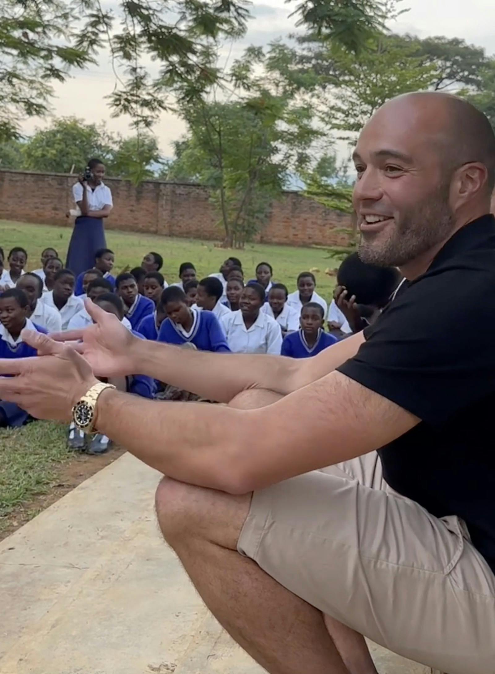 Nicholas Palahnuk speaking to a group of kids in Malawi