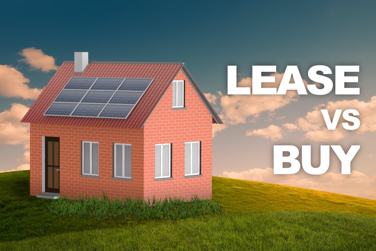 A red brick home with rooftop solar panels sits on green grass with the words "Lease vs Buy" on the right-hand side of the image, for homeowners who are thinking about the pros and cons of solar leasing.